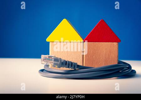 Internet connection to the house. Internet cable and installation of a Wi-Fi point. Installation of equipment in the house. Stock Photo