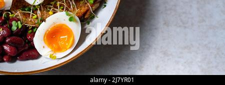 Medium boiled eggs with sasld, healthy breakfast Stock Photo
