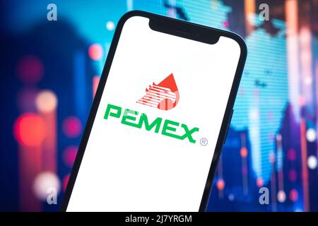 Poltava, Ukraine - May 11, 2022: Pemex logo company, gas and oil prices, energy industry. Petroleum stock market graphs, global financial background. Stock Photo