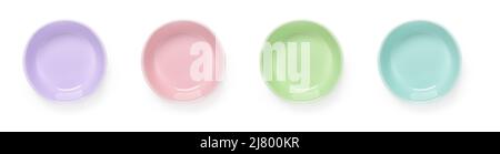 Set of multicolored ceramic bowls isolated on a white background. Empty colorful porcelain ramekins cutout. Pastel colored dishes and tableware. Stock Photo