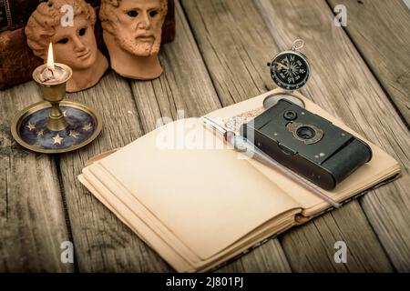 vintage travel memories concept. Old camera, binoculars, letters and map-holder with map. copy space. Stock Photo