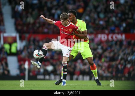 Pharrell Johnson #5 of Nottingham Forest clears from Alejandro Garnacho ...