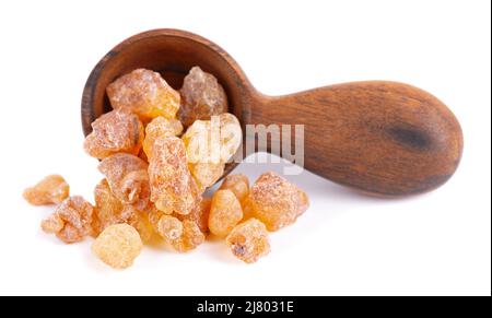 Frankincense resin in wooden spoon, isolated on white background. Pile of natural frankincense Olibanum. Incense Stock Photo