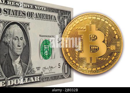 US one dollar bill standing in perspective with a shiny golden Bitcoin i front. Exchange US dollars for bitcoin. Concept image isolated on white backg Stock Photo