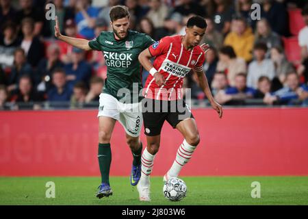 EINDHOVEN - (lr) Javier Vet of NEC, Cody Gakpo of PSV Eindhoven during the Dutch Eredivisie match between PSV Eindhoven and NEC at Phillips Stadium on May 11, 2022 in Eindhoven, Netherlands. ANP JEROEN PUTMANS Stock Photo