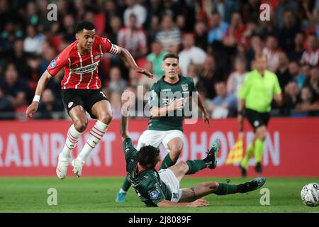 EINDHOVEN - (lr) Cody Gakpo of PSV Eindhoven, Ivan Marquez of NEC during the Dutch Eredivisie match between PSV Eindhoven and NEC at Phillips Stadium on May 11, 2022 in Eindhoven, Netherlands. ANP JEROEN PUTMANS Stock Photo