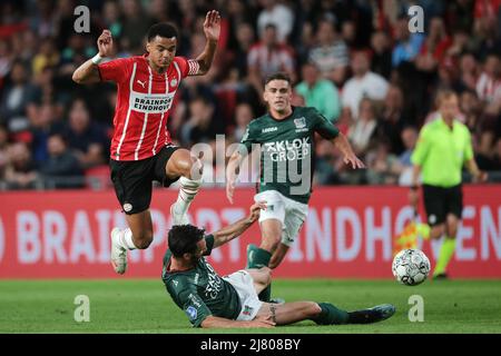 EINDHOVEN - (lr) Cody Gakpo of PSV Eindhoven, Ivan Marquez of NEC during the Dutch Eredivisie match between PSV Eindhoven and NEC at Phillips Stadium on May 11, 2022 in Eindhoven, Netherlands. ANP JEROEN PUTMANS Stock Photo