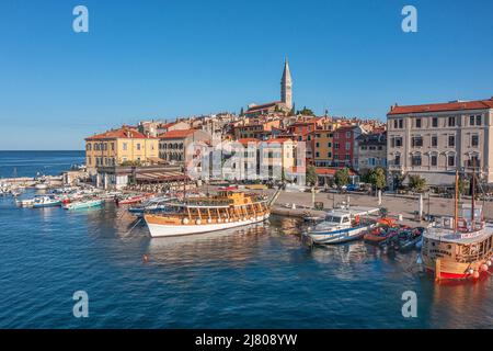 ROVINJ, CROATIA - August 19th, 2021: Many boats in the harbour near olld town of Rovinj, popular travel destination in Croatia Stock Photo