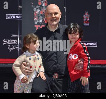 (L-R) Philomena Corgan, Billy Corgan of Smashing Pumpkins and Augustus ...