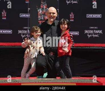 (L-R) Philomena Corgan, Billy Corgan of Smashing Pumpkins and Augustus ...