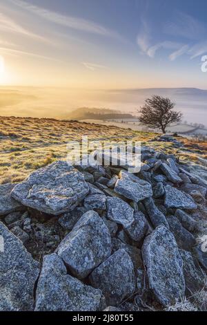 UK landscape photographer John Finney captured this stunning misty sunrise this morning over Win Hill in the Derbyshire Peak District, Derbyshire United Kingdom Featuring: Winhill and Bamford sunrise, Peak District. UK Where: Derbyshire, United Kingdom When: 01 Mar 2021 Credit: John Finney/WENN Stock Photo