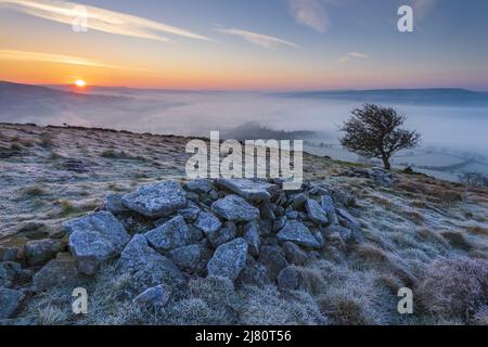 UK landscape photographer John Finney captured this stunning misty sunrise this morning over Win Hill in the Derbyshire Peak District, Derbyshire United Kingdom Featuring: Winhill and Bamford sunrise, Peak District. UK Where: Derbyshire, United Kingdom When: 01 Mar 2021 Credit: John Finney/WENN Stock Photo