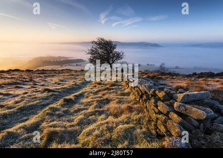 UK landscape photographer John Finney captured this stunning misty sunrise this morning over Win Hill in the Derbyshire Peak District, Derbyshire United Kingdom Featuring: Winhill and Bamford sunrise, Peak District. UK Where: Derbyshire, United Kingdom When: 01 Mar 2021 Credit: John Finney/WENN Stock Photo