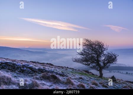 UK landscape photographer John Finney captured this stunning misty sunrise this morning over Win Hill in the Derbyshire Peak District, Derbyshire United Kingdom Featuring: Winhill and Bamford sunrise, Peak District. UK Where: Derbyshire, United Kingdom When: 01 Mar 2021 Credit: John Finney/WENN Stock Photo