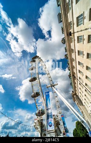 Lonon,England,UK-August 21 2019: At the Millennium Wheel,outside County Hall, on the South Bank of theThames,fluffy white clouds pass over the iconic Stock Photo