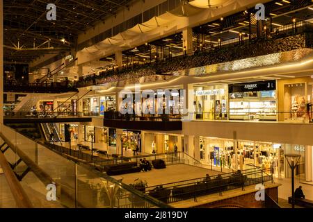 Gdansk Poland - April 2022. Forum gallery shopping mall view of the interior of the building at night. Modern shopping and entertainment centre. Architecture in the city center of Gdansk is the historical capital  Stock Photo