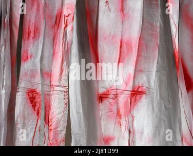 Horror Halloween haunted house background from sheets of thin white paper and red paint Stock Photo