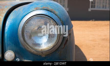 Detail view of an old and rusty car. car park at Solitaire service station located in the Namib Desert of Namibia, Africa. Stock Photo