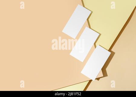 Three white sheets of paper on color background Stock Photo