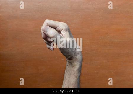 Hand muscle rigidity and finger flexion of Asian elder man Stock Photo ...