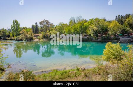 Backwater with emerald water behind the Manavgat waterfall in Side, Turkey Stock Photo