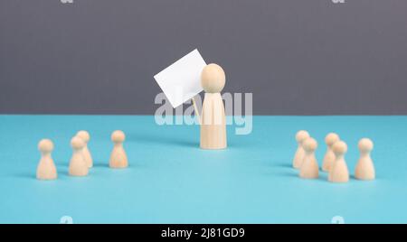 Group of people, teacher with children, manager recruiting workers, standing out from the crowd, teamwork and leadership, man holds empty sign Stock Photo