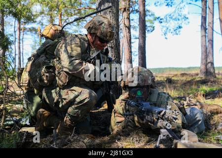 Drawsko Pomorskie, Poland. 29th Apr, 2022. U.S. Army Soldiers assigned to the 3rd Armored Brigade Combat Team, 4th Infantry Division, conduct scout operations where they clear the objective before moving forward at Drawsko Pomorskie, Poland, April 29, 2022. The 3/4 ABCT is among other units assigned to V Corps, America's forward-deployed corps in Europe that works alongside NATO allies in joint, bilateral, and multinational training exercises. Credit: U.S. Amy/ZUMA Press Wire Service/ZUMAPRESS.com/Alamy Live News Stock Photo