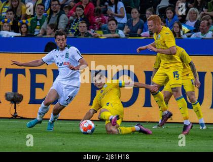 Monchengladbach, North Rhine-Westphalia, Germany. 11th May, 2022. Borussia Monchengladbach defender JOE SCALLY (29) attempts to dribble around Ukrainian captain TARAS STEPANENKO (6) and YUKHYM KONOPLYA (15). Borussia Monchengladbach hosted Ukraine in the Borussia Park in Monchengladbach. (Credit Image: © Kai Dambach/ZUMA Press Wire) Stock Photo