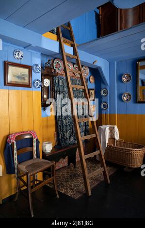 Old fashioned Dutch interior and room decoration in small fisherman's wooden houses in North-Holland, Enkhuizen, Netherlands Stock Photo