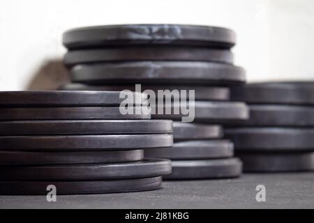 Image of black gym weigth plates on the floor Stock Photo