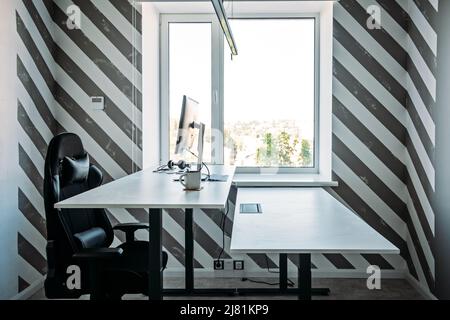 Standing Workplace. Working in Standing Position. Standing desk for work from home or in office. Stock Photo