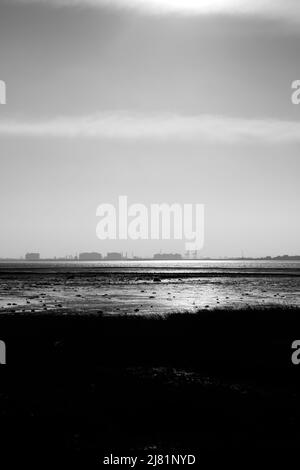 View across the Thames Estuary from Canvey Island to the Hoo Peninsula and Isle of Grain, Kent, England, UK Stock Photo