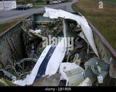02 July 2002, Baden-Wuerttemberg, Überlingen: Debris from one of the two crashed planes lies in a container being taken to the Lake Constance airport. More than 70 people were killed in an aircraft collision over Lake Constance on July 4, 2002. A Tupolev Tu-154 of Bashkirian Airlines had collided with a Boeing 757 cargo plane of the parcel service DHL. Photo: Felix Kästle/dpa Stock Photo