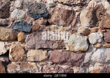Medieval old european orange and brown brick wall background Stock Photo