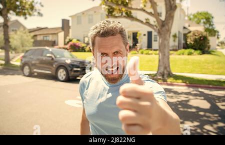 happy bearded man showing thumb up, approved Stock Photo