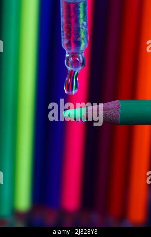 Water droplet onto pencil Stock Photo