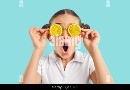 Amazed girl kid in glasses feeling surprised Stock Photo