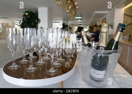 Palma, Spain. 11th May, 2022. Champagne bottles and glasses are at the reception of the hotel Iberostar Selection Playa de Palma on the beach of Arenal in Mallorca. Credit: Clara Margais/dpa/Alamy Live News Stock Photo