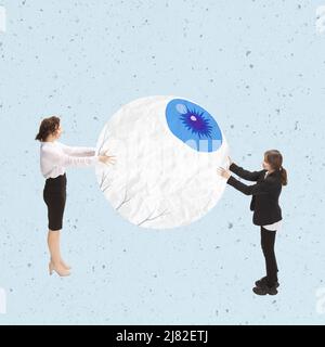 Contemporary art collage. Women, office workers, programmers holding giant eye, symbolising development of artificial intelligence Stock Photo