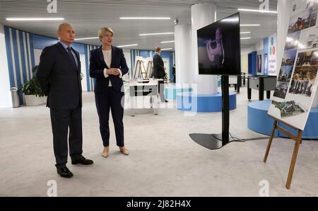 Sochi, Russia. 12th May, 2022. Russian President Vladimir Putin Before is given a tour of the new sports facilities of the Sirius Educational Centre by foundation director Yelena Shmeleva, before a meeting of the Board of Trustees, May 11, 2022 in Sochi, Russia. Credit: Mikhail Metzel/Kremlin Pool/Alamy Live News Stock Photo