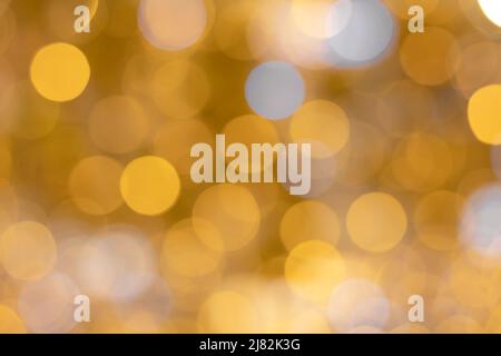 Background image of bright iridescent yellow and white bokeh colors. Defocus effect Stock Photo