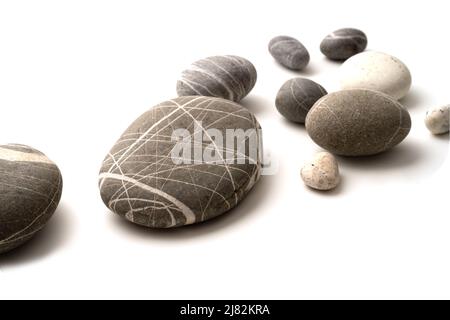 Round stones on white background , Stones or Gravel for building, floor or wall. Stock Photo