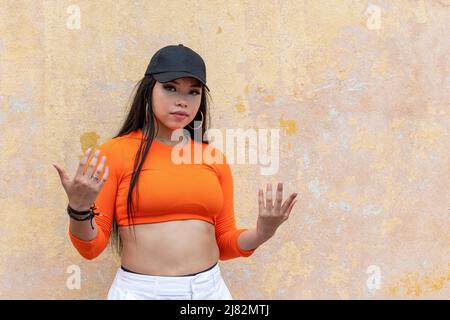 Funky young latin woman hip hop dancing in the street, Panama - stock photo Stock Photo