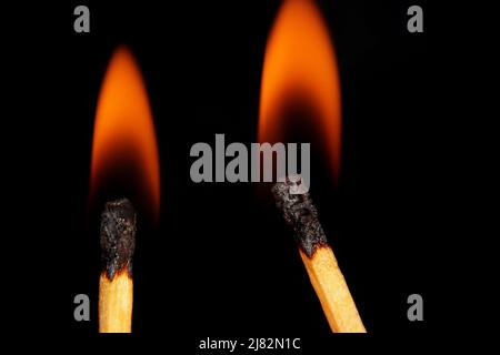 close-up burning match on black background Stock Photo