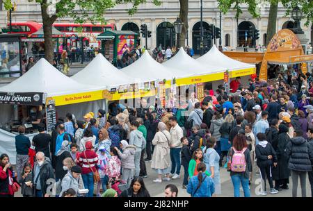 London celebrates Eid in the Square at Trafalgar Square with market food stalls. The event marks the end of Ramadan, the Islamic holy month of fasting Stock Photo