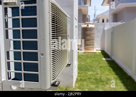 Air conditioner compressor outdoor unit installed outside the building ...