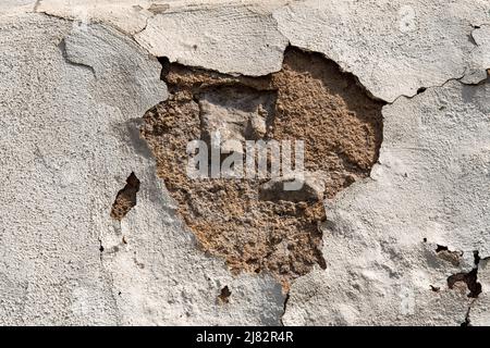 House facade vintage crumbling plaster and brick wall Stock Photo