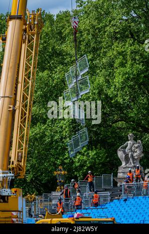London, UK. 12th May, 2022. Grandstands are constructed around the flags that surround the Victoria Monument, outside Buckingham Palace, for the audiences for the weekend parties/events to come. Preparations for the celebration of the Platinum Jubilee of HM The Queen Elizabeth. Credit: Guy Bell/Alamy Live News Stock Photo