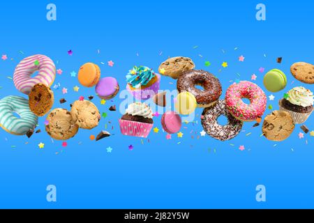 Donuts, cupcakes, cookies, macarons flying on blue background. Stock Photo