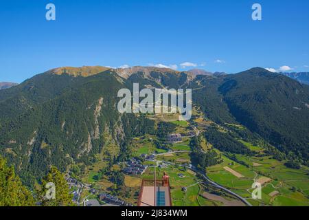 Aerial View of Canillo town and nature mountains landscape from Roc del Quer observation deck during a sunny spring day in Andorra Stock Photo